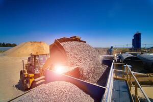 Carriage on loading with crushed stone. transportation of bulk materials. Career or quarry photo