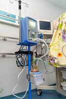 Artificial lung ventilation unit in the medical ward. Selective focus on equipment with oxygen mask. Closeup. photo