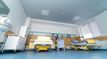 Professional healthcare treatment empty light ward. Nobody modern healthcare emergency ward. photo