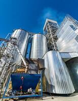 Big trolley for moving dry grain on factory from one tank to another. Closeup. photo