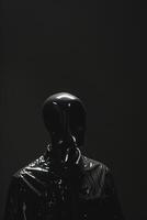 Minimalist Black Mannequin Head in High-Contrast Lighting photo