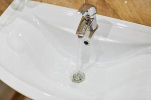 Faucet in bathroom interior. photo