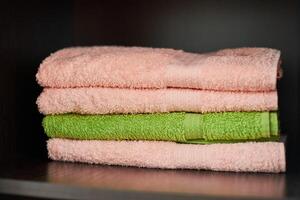 Towels stack on shelf photo