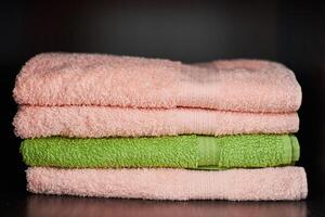 Towels stack on shelf photo