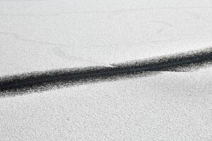 Abstract black line on snow-white background. Cracked ice photo