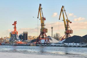 Harbor cranes, container ship terminal, cargo container yard photo