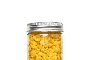 Wax beans for hair removal, isolated. photo