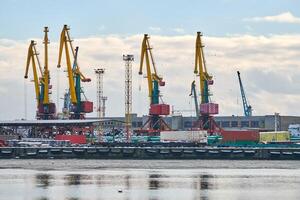 Harbor cranes, container ship terminal, cargo container yard photo