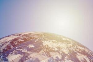 Earth planet modern building with clouds and blue sky in sunlight, ecological architectural concept photo