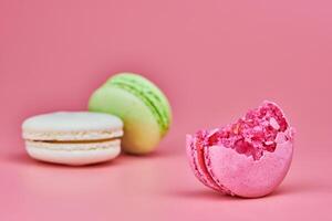 Macaroons on pink background photo