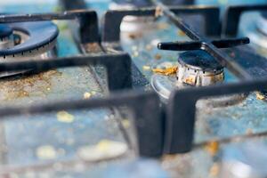 Dirty stove top with oil splatters, fat stains and food leftovers photo