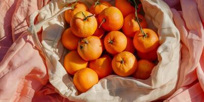 Sun-Kissed Citrus Tangerines in a Cotton Bag with Rosy Hues photo