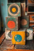 Vintage Wooden Target Blocks Stacked on Rustic Table photo