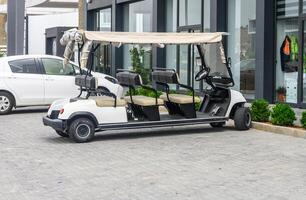 A group of tourists driving through the forest in electric car. photo