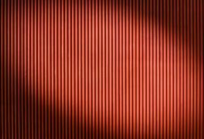 The texture of the fence made of red profiled sheet. Background. Space for text. 4 photo