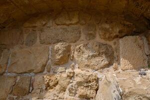 Part of the ancient stone wall, background, archaelogical site 1 photo