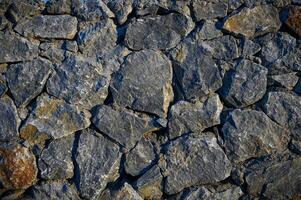 Wall with various size and shaped stones 2 photo