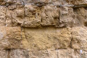 textura de un antiguo ladrillo pared hecho de arenisca. arqueológico excavaciones 3 foto