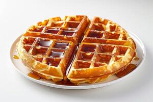 frount view of a waffle with honey on white background photo