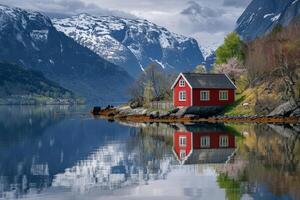 Beautiful lake house with snowy mountain background photo