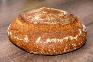 appetizing homemade whole grain bread on a wooden table 6 photo