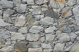 Natural stone granite wall. Seamless texture. Perfect tiled on all sides. photo