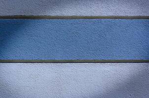 plastered wall painted with stripes. background . space for text1 photo