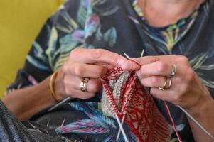 woman knits socks. knitting needles. female hands close up.1 photo