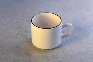 empty coffee cup on stone table photo