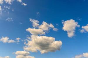 blue sky with clouds and sun reflection.The sun shines bright in the daytime in summer photo