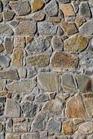 Stone Veneers, cladding wall made of stacked slabs of natural rocks photo