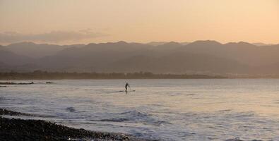 man doing SUP boarding on the Mediterranean Sea 8 photo