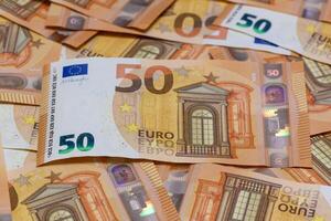 many 50 euro bills close-up mixed haphazardly 3 photo