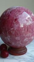 Elegant Marbled Sphere. A Symphony of Rich Reds and Intricate Veins photo