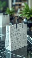 Elegant Shopping Bag on a Glossy Counter Amidst a Modern Decor photo