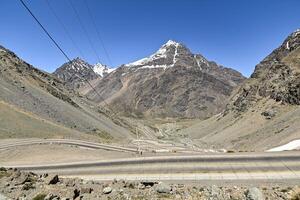 Los Caracoles desert highway, with many curves, in the Andes mountains photo