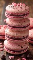Decadent Pink Macarons Stacked, Sprinkled with Cocoa and Garnished with Candy photo