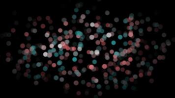 red and turquoise blurry abstract particles slowly moving over black background video