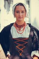 Portrait of brunette woman dressed in historical Baroque clothes photo