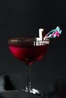 Alcoholic drink. A cocktail with elite alcohol on dark black background photo