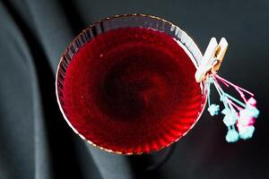 Alcoholic drink. A cocktail with elite alcohol on dark black background photo