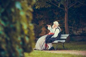 Portrait of blonde woman and man dressed in historical Baroque clothes photo