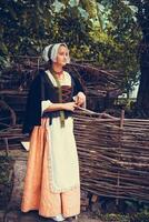 Portrait of brunette woman dressed in historical Baroque clothes photo