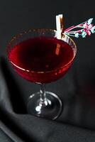 Alcoholic drink. A cocktail with elite alcohol on dark black background photo