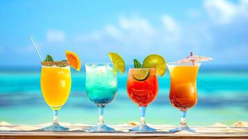 Tropical cocktail drink in glasses on ocean or seascape background. Summer vacation concept. photo