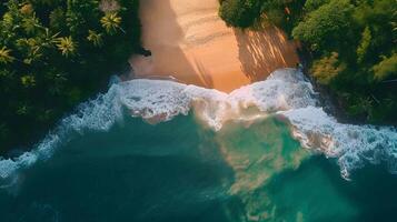 Amazing aerial view of emerald green sea, small white sand beach with green forest peaceful and white foamy waves crashing on the shore on a sunny day. photo