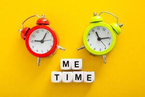 Me Time word with clock on yellow background photo