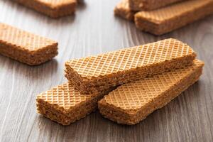 Chocolate wafer biscuit on wooden table photo