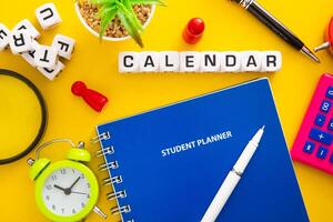 Student Planner on yellow background. Flatlay photo