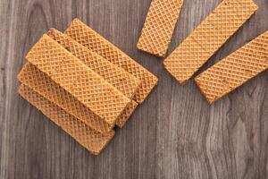 Chocolate wafer biscuit on wooden table photo